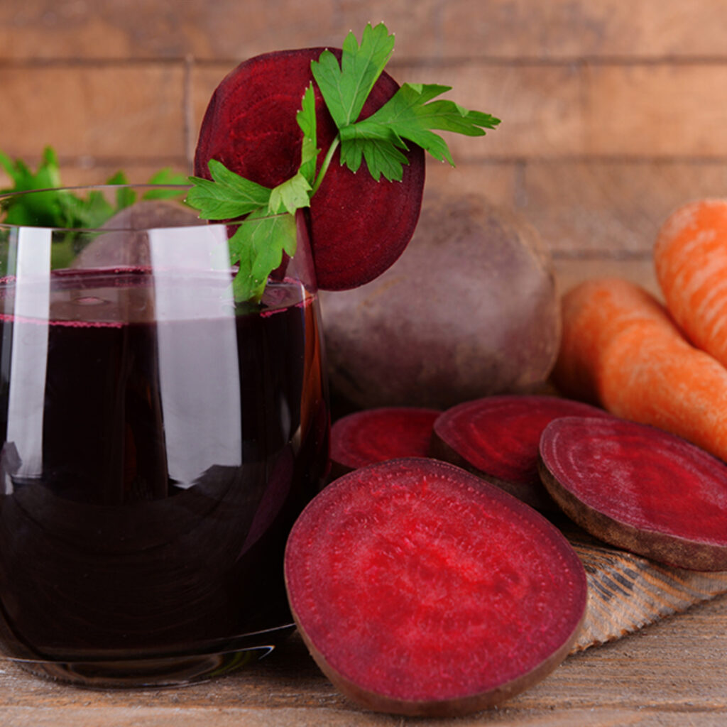 Beautiful image of beet and carrot juice with a bit of a garnish