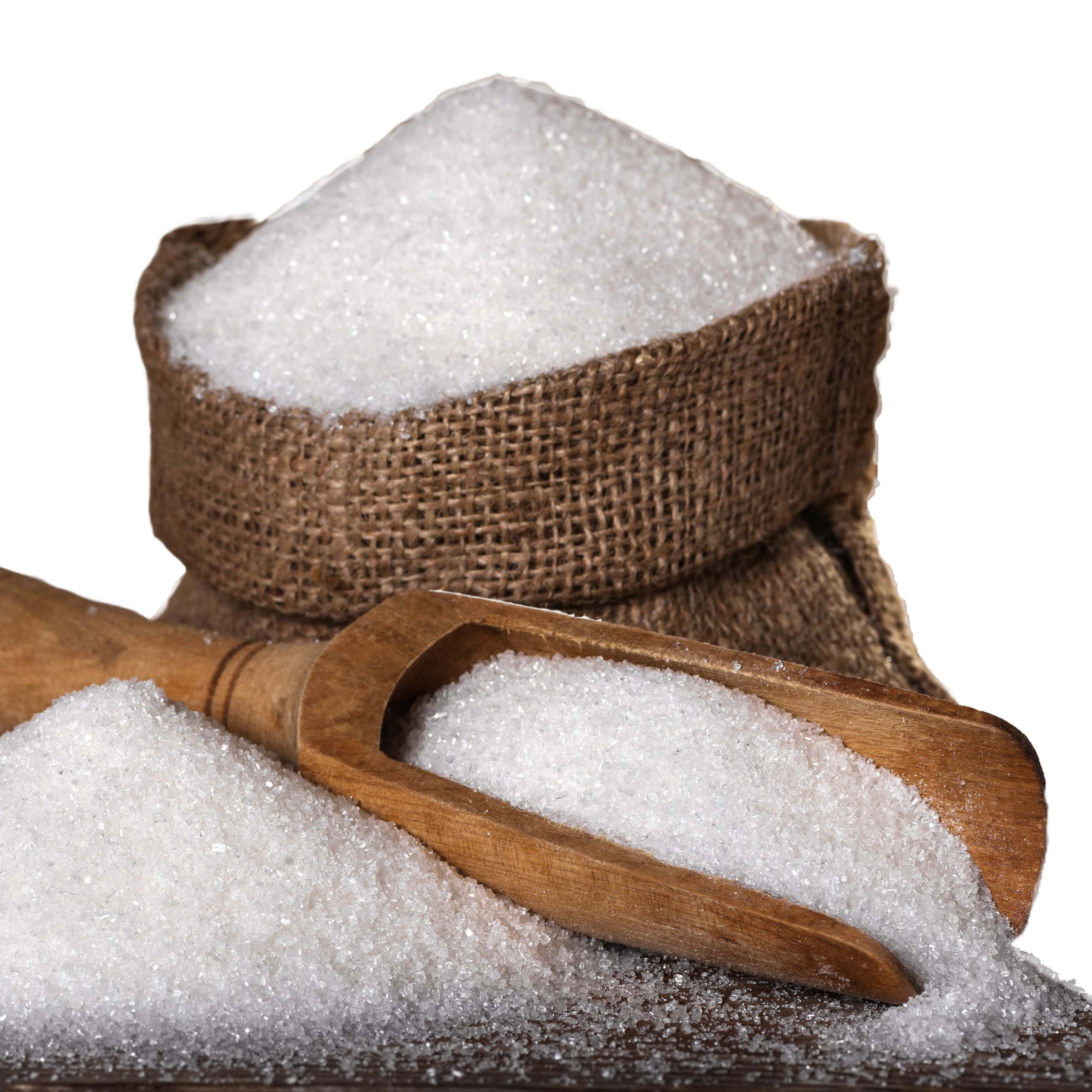 A burlap sack filled with white granulated sugar, with a wooden scoop and loose sugar scattered on a flat surface, against a white background.